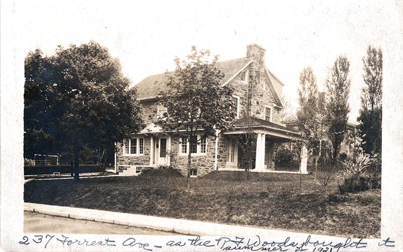 3-story stone house with covered terrace