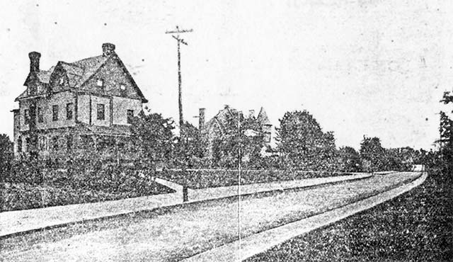 grainy images of a large house next to an empty street with sidewalks