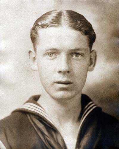 head and shoulders photo of young man in sailor uniform