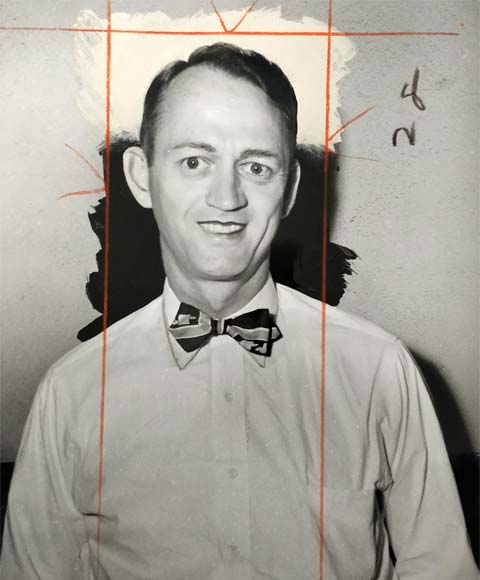 smiling young man wearing white shirt, bow tie