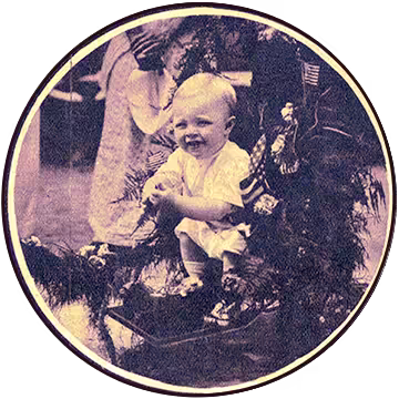 toddler with a broad smile in a baby stroller