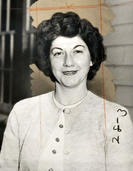 smiling woman with dark curly hair