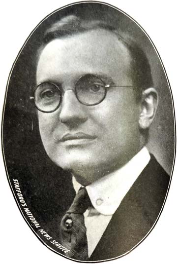 bespedftacled middle age man in tie with stickpin