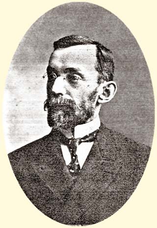 middle aged bearded man in formal dress, head and shoulders photo portrait