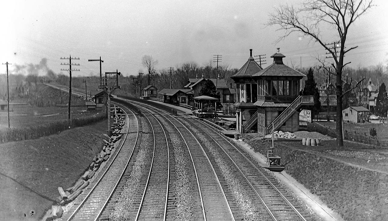 train tracks with signal and two control towers